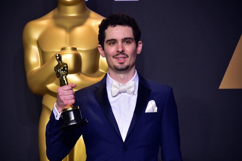 (FILES) This file photo taken on February 26, 2017 shows Damien Chazelle posing in the press room with the Oscar for Best Director during the 89th Annual Academy Awards in Hollywood, California.
Oscar-winning director Damien Chazelle is to bring an eight-episode musical drama set in Paris to Netflix, the internet streaming service announced on Friday. The "La La Land" director will helm two episodes of "The Eddy" and executive produce the entire series, which focuses on a club, its owner, the house band and the "chaotic city that surrounds them," Neflix said. / AFP PHOTO / FREDERIC J. BROWN