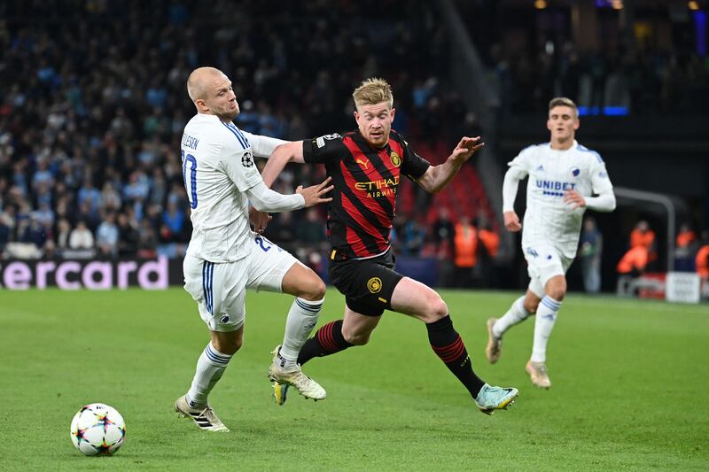 FC Copenhagen's Nicolai Boilesen grapples with Manchester City's Kevin de Bruyne. AFP