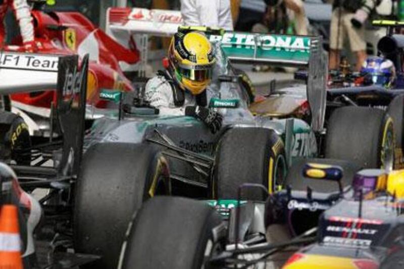 Lewis Hamilton climbs out of his Mercedes after taking the pole for the Chinese Grand Prix in qualifying, which was a relatively boring affair until the final moments.