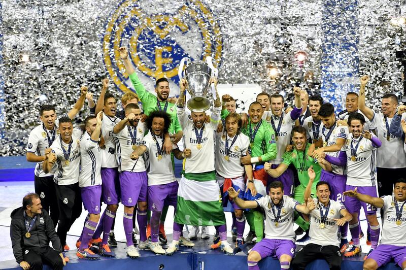 CARDIFF, WALES - JUNE 03:  In this handout image provided by UEFA, Sergio Ramos of Real Madrid lifts The Champions League trophy after the UEFA Champions League Final between Juventus and Real Madrid at National Stadium of Wales on June 3, 2017 in Cardiff, Wales.  (Photo by Handout/UEFA via Getty Images)