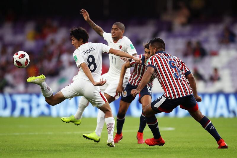 Shoma Doi of Kashima Antlers stretches to control the ball under pressure from Marin. Getty Images