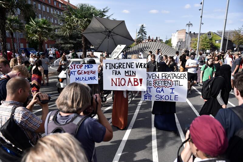 Niqab and burqa wearing women protest on the first day of the Danish face veil ban. EPA