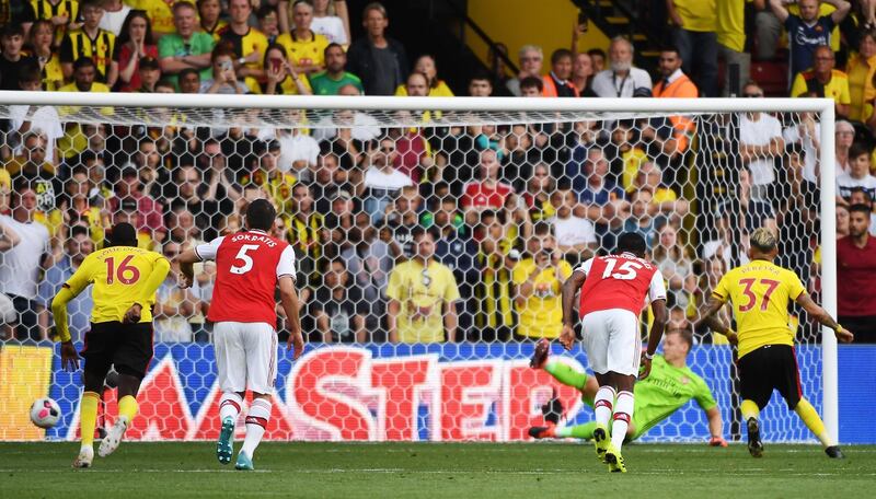 Watford's Roberto Pereyra scores from the penalty spot to make it 2-2. EPA