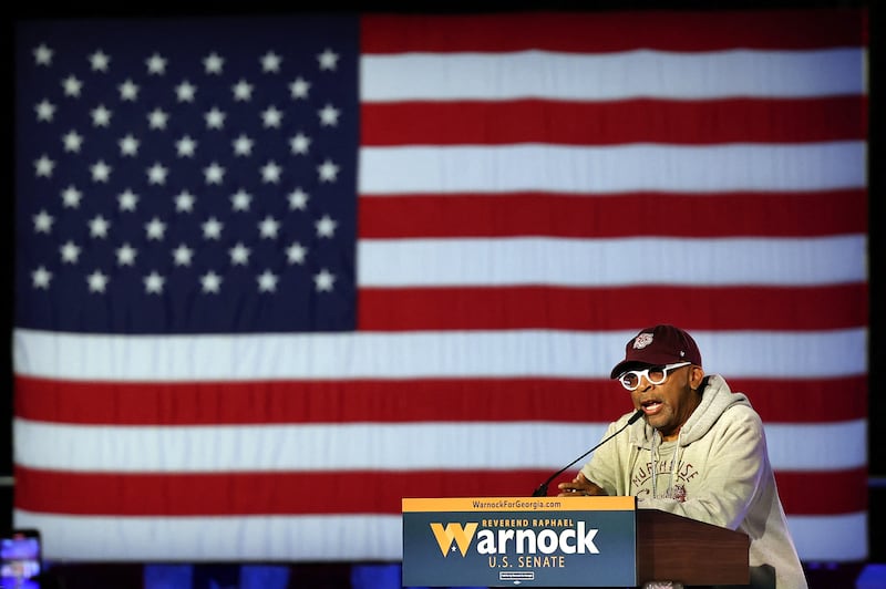 Director Spike Lee speaks to the crowd at Mr Warnock's watch party. Getty / AFP