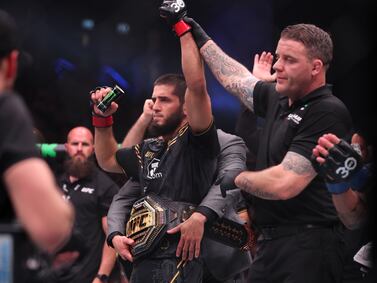 Islam Makhachev has his hand raised in victory after beating Alexander Volkanovski at UFC 294 in Abu Dhabi last October. Chris Whiteoak / The National