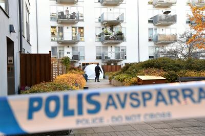 Police forensics experts at the scene in the Hammarby Sjostad district in Stockholm, Sweden. EPA