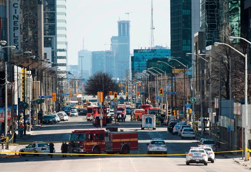 Emergency services close Yonge Street in Toronto after the van mounted a sidewalk crashing into a crowd of pedestrians. Nathan Denette/The Canadian Press via AP