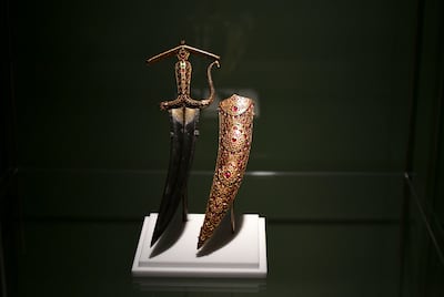 The Jewelled Chilanum Dagger & Scabbard has three animals, a tiger's head, an elephant and a horse's head designed into its hilt. Khushnum Bhandari / The National