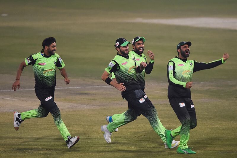 Lahore Qalandars players celebrate the dismissal of Multan Sultans' Shan Masood during the PSL final at the Gaddafi Stadium in Lahore on February 27, 2022. AFP