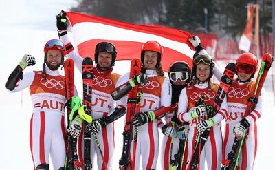 PYEONGCHANG-GUN, SOUTH KOREA - FEBRUARY 24:  Silver medallists Austria with Marco Schwarz, Michael Matt, Manuel Feller, Katharina Liensberger, Katharina Gallhuber and Stephanie Brunner celebrate during the victory ceremony for the Alpine Team Event Big Final on day 15 of the PyeongChang 2018 Winter Olympic Games at Yongpyong Alpine Centre on February 24, 2018 in Pyeongchang-gun, South Korea.  (Photo by Ezra Shaw/Getty Images)