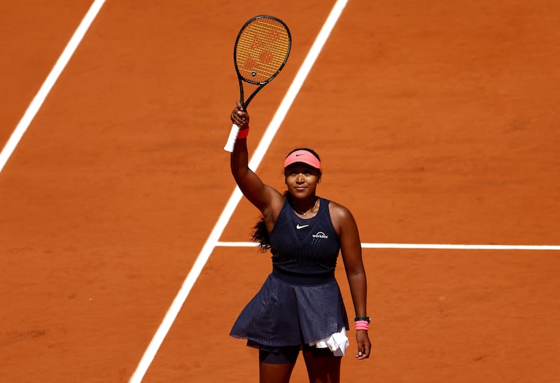 Naomi Osaka waves to the crowd at Roland Garros. Reuters