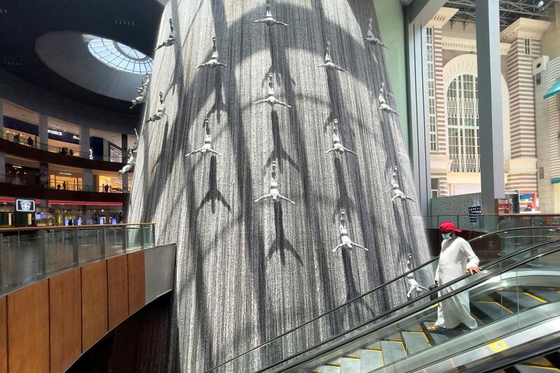 Shoppers walk through the Dubai Mall in Dubai, United Arab Emirates, June 11, 2021. Picture taken June 11, 2021. REUTERS/Christopher Pike