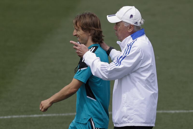 Real Madrid coach Carlo Ancelotti talks to Luka Modric during training for the Champions League final. EPA 