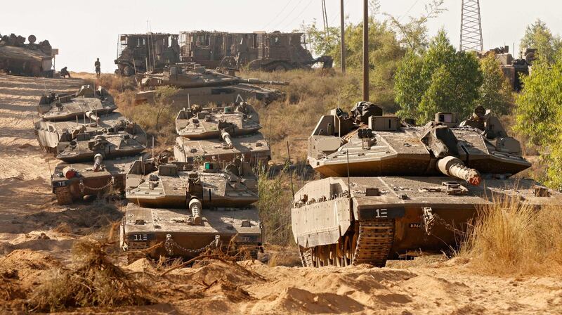 Israeli tanks stationed along the border with the Gaza Strip. AFP