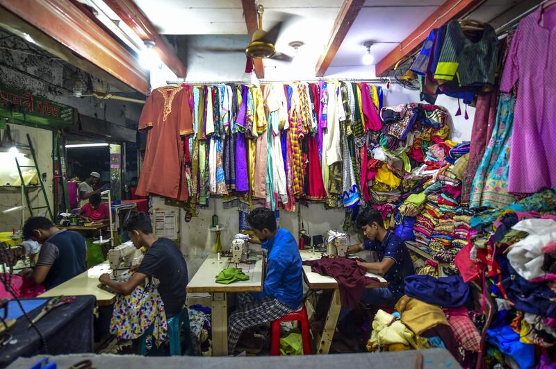 Bangladeshi tailors work ahead of Eid Al Fitr in Dhaka.  AFP