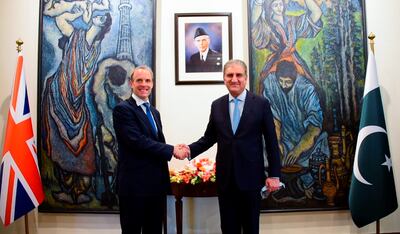 Pakistan's Foreign Minister Shah Mahmood Qureshi welcomes Britain's Foreign Secretary Dominic Raab upon his arrival at the Ministry of Foreign Affairs in Islamabad. Reuters