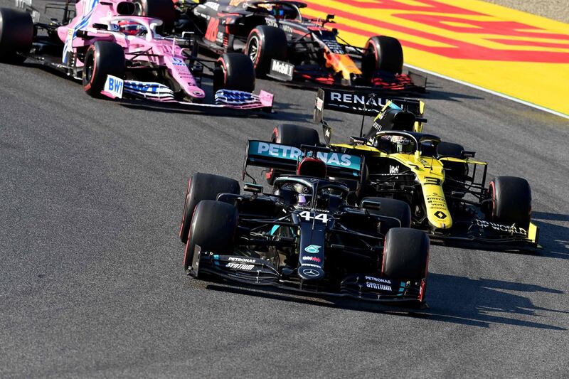 Lewis Hamilton takes the lead at the race restart in front of Renault's Daniel Ricciardo. AFP