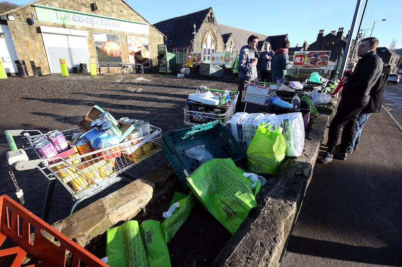 A Co-op provide essentials for residents after flooding in Mytholmroyd, West Yorkshire in December 2015
