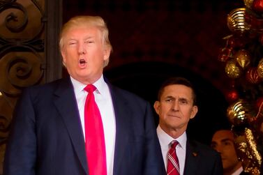Michael Flynn (R) lasted only 24 days as Donald Trump's first national security adviser. AFP