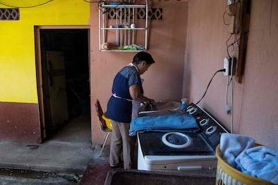 Costa Rican domestic worker Aracelly Calvo irons clothes at the house where she works in Guanacaste, Canas, Costa Rica on January 04, 2019.  The working conditions of domestics in Latin America, to whom director Alfonso Cuaron pays homage in his recent movie 'Roma', is slowly reaching a legal framework. Whilst several countries in the region have established laws for the sector in the last decade, other simultaneous realities such as economic crises and migration, are hampering those conquests and ambitions of formality. / AFP / Ezequiel BECERRA
