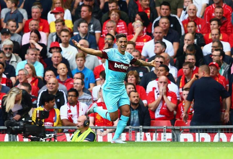 Manuel Lanzini of West Ham United celebrates scoring his team's first goal during their Premier League match against Liverpool at Anfield in August. Clive Mason / Getty Images