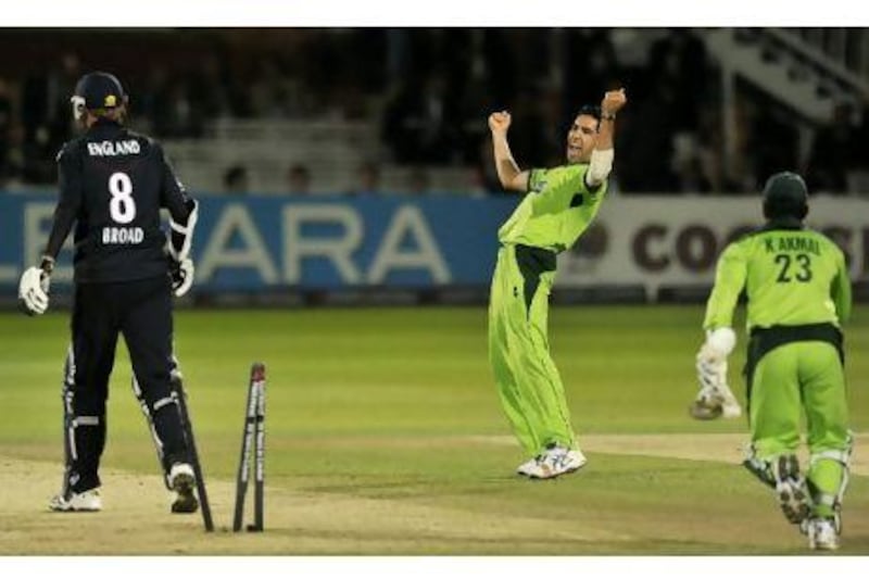Pakistan's Umar Gul, right, celebrates bowling England's Stuart Broad for two and winning the fourth one-day international in England in 2010.