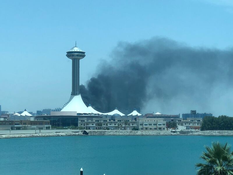 Black smoke rises from behind Marina Mall in Abu Dhabi at around 12pm on Tuesday. Courtesy: Zeid Salman Twitter