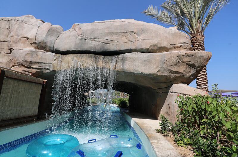 The lazy river flows under waterfalls at the hotel's on-site waterpark.