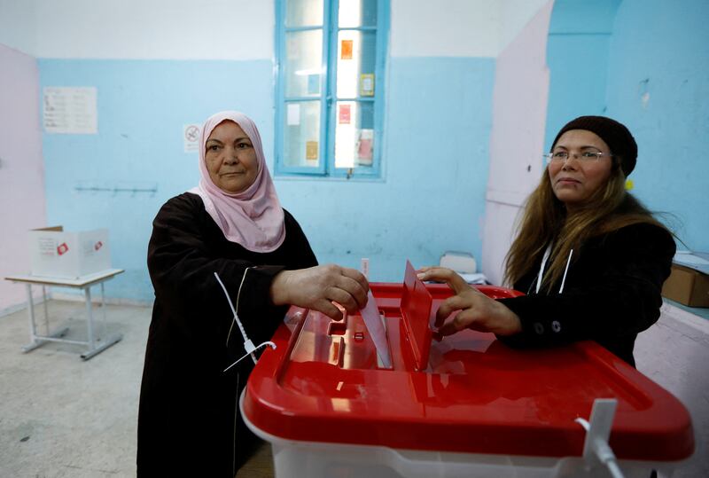 A voter casts her ballot at a polling station in Tunis. Reuters