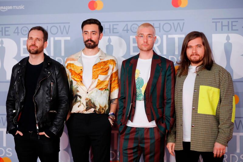 Dan Smith, Kyle Simmons, Will Farquarson and Chris Wood of Bastille arrives at the Brit Awards 2020 at The O2 Arena on Tuesday, February 18, 2020 in London, England. AFP