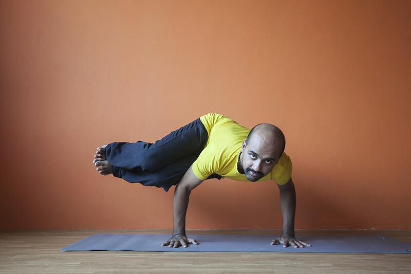 Ajith Shankara shows his skills at his newly opened Lotus Holistic Yoga Centre in Motor City. Mona Al Marzooqi / The National