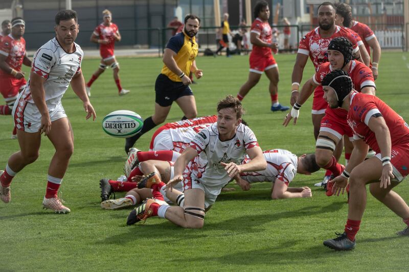 Action from the UAE Premiership game between Abu Dhabi Harlequins (in white) and Dubai Tigers at Zayed Sports City. Antonie Robertson / The National