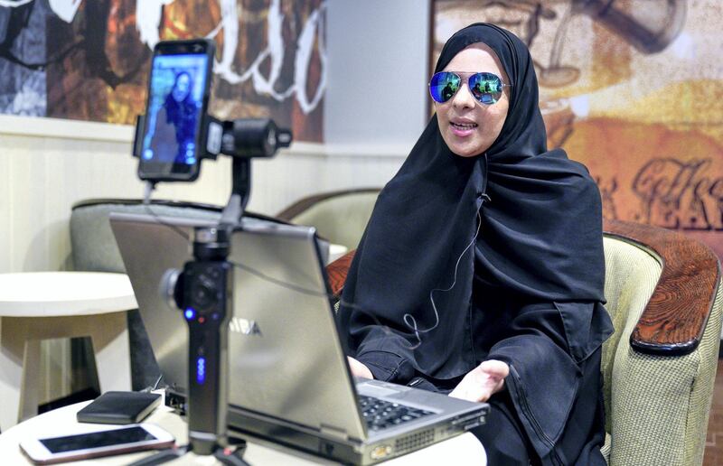 Abu Dhabi, United Arab Emirates, July 1, 2019.   Amal Al Mansouri, an Emirati girl of determination and a cartoon dubbing artist, whose work was praised during the Special Olympics World Games in Abu Dhabi earlier this year. --  Amal dubbing a cartoon to the Arabic language using her laptop.
Victor Besa/The National
Section:  NA
Reporter:  Ruba Haza