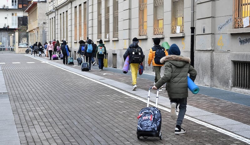 Middle school students make their way to Tommaseo School in Turin, Italy. EPA