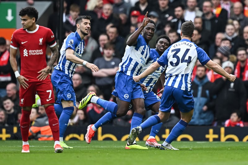 Brighton striker Danny Welbeck, centre, celebrates after scoring his team's first goal against Liverpool. AFP