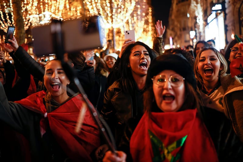 Moroccans party on the Champs Elysees avenue in Paris. EPA
