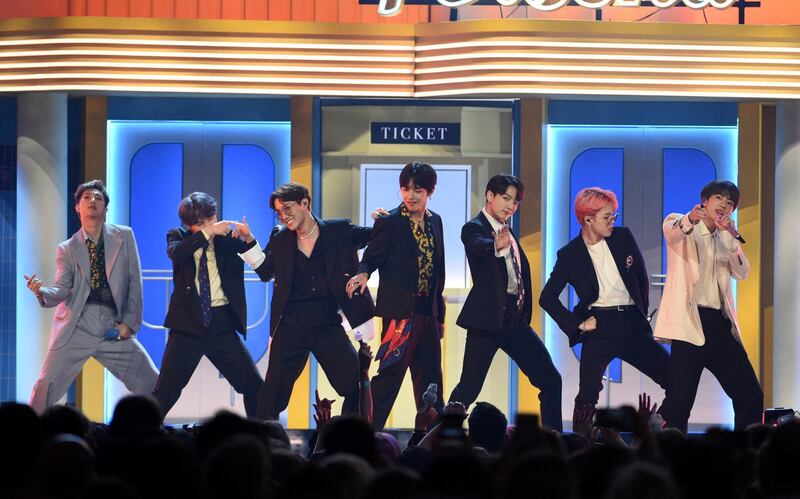 FILE - This May 1, 2019 file photo shows BTS performing "Boy With Luv" at the Billboard Music Awards in Las Vegas. The Korean pop band is set to perform on the iHeartRadio Jingle Ball Tour this holiday season. IHeartMedia announced Friday, Sept. 27, 2019, that the 12-city tour kicks off Dec. 1 in Tampa Bay, Florida. (Photo by Chris Pizzello/Invision/AP, File)