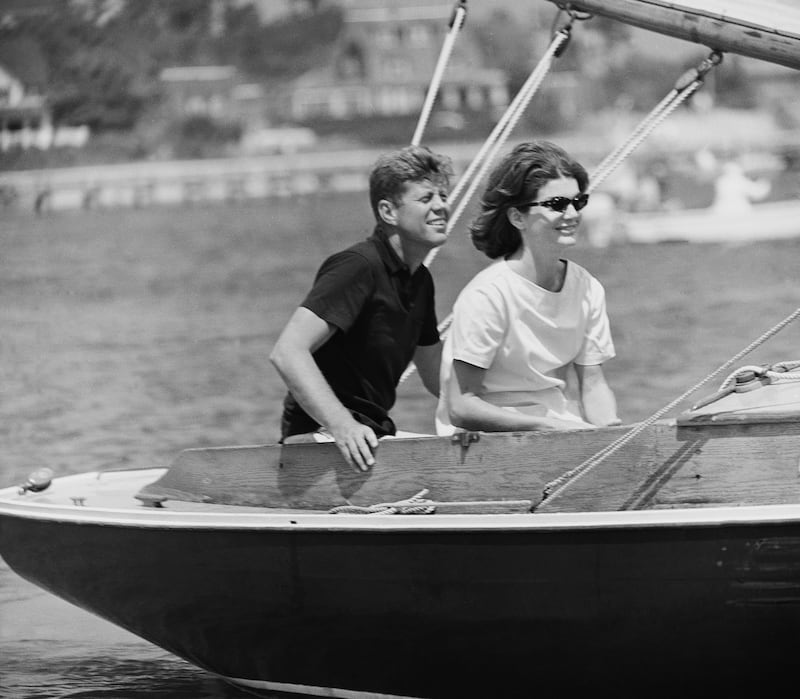 John F Kennedy and wife Jacqueline take a ride on their sailboat in Hyannis Port. AP