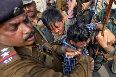 Police officers try to detain demonstrators during a protest against the Citizenship Amendment Bill, that seeks to give citizenship to religious minorities persecuted in neighbouring Muslim countries, in Agartala, India, December 11, 2019. Reuters