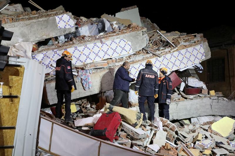 Rescue workers search on a collapsed building after an earthquake in Elazig. Reuters