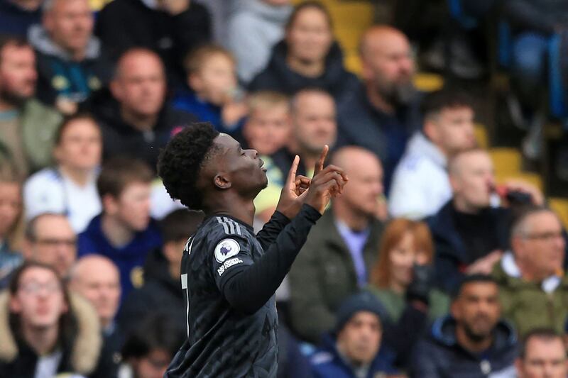 Arsenal's English midfielder Bukayo Saka celebrates after scoring the opening goal of the English Premier League football match between Leeds United and Arsenal at Elland Road in Leeds, northern England on October 16, 2022.  (Photo by Lindsey Parnaby / AFP) / RESTRICTED TO EDITORIAL USE.  No use with unauthorized audio, video, data, fixture lists, club/league logos or 'live' services.  Online in-match use limited to 120 images.  An additional 40 images may be used in extra time.  No video emulation.  Social media in-match use limited to 120 images.  An additional 40 images may be used in extra time.  No use in betting publications, games or single club/league/player publications.   /  