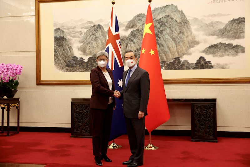 Australian Foreign Minister Penny Wong meets China's departing Foreign Minister, Wang Yi, in Beijing last month. Reuters