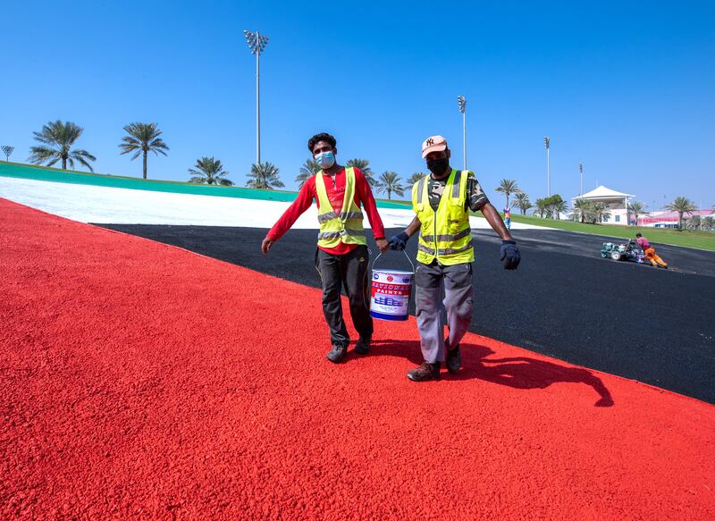 Yas Marina Circuit painting the UAE flag on Abu Dhabi Hill in preparation for the Formula 1 Etihad Airways Abu Dhabi Grand Prix 2021 this December 9-12. Victor Besa / The National