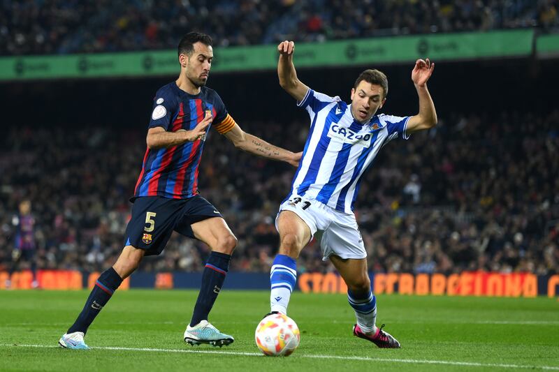 Barca's Sergio Busquets battles for possession with Jon Ander Olasagasti. Getty