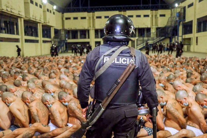 Gang members are secured during a police operation at Izalco jail during a 24-hour lockdown ordered by El Salvador's President Nayib Bukele in Izalco, El Salvador. Reuters