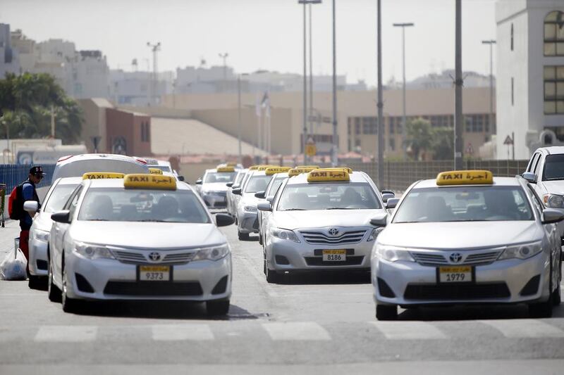 Taxis waiting for passengers on the first day of the Eid holiday near the Abu Dhabi bus terminal. Ravindranath K / The National 

