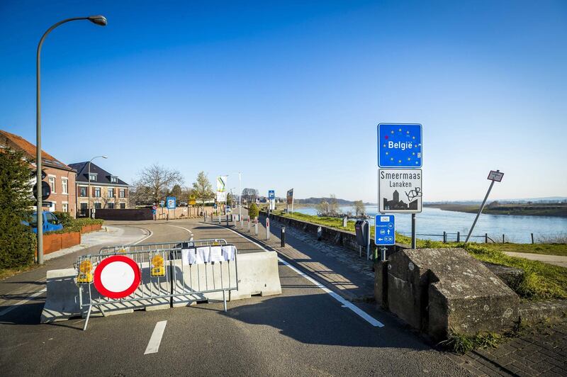 epa08336339 Concrete barriers and fences block the border between Belgium and the Netherlands, in Maastricht, The Netherlands, 01 April 2020. The mayor of Belgian city Lanaken has decided to close the border because of the market in Maastricht. The Maastricht municipality organizes a Wednesday and Friday market. The mayor of Lanaken wants to prevent many Belgians from coming to the market. Countries around the world are taking measures to contain the widespread of the SARS-CoV-2 coronavirus which causes the Covid-19 disease.  EPA/MARCEL VAN HOORN