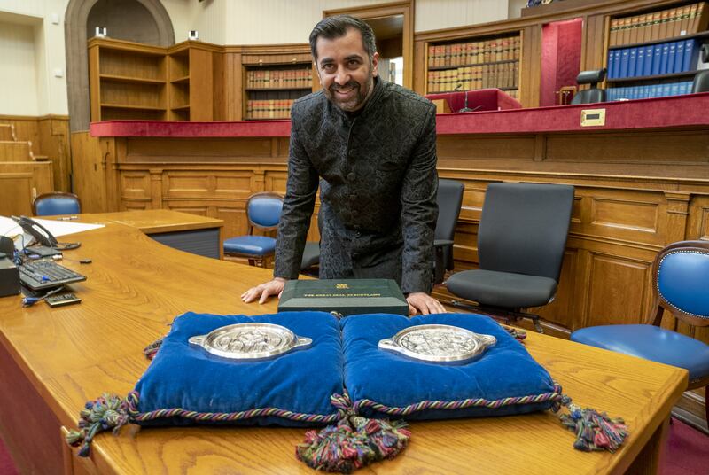 Mr Yousaf poses with the Great Seal of Scotland after being sworn in