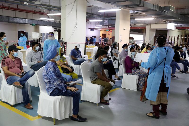 DUBAI, UNITED ARAB EMIRATES , Feb 6 – PEOPLE WAITING TO GET THE FIRST DOSE OF SINOPHARM VACCINATION DURING THE VACCINATION DRIVE AT THE GURU NANAK DARBAR GURUDWARA IN DUBAI. Guru Nanak Darbar Gurudwara has partnered with Tamouh Health Care LLC, to provide on-site Sinopharm Vaccination for all residents of the UAE free of charge on 6th, 7th & 8th February 2021. (Pawan Singh / The National) For News/Online