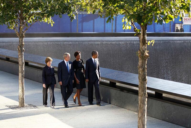 U.S. President Barack Obama (R), first lady Michelle Obama (2nd R), former U.S. President George W. Bush (2nd L) and former first lady Laura Bush walk beside the North pool of the WTC Memorial during ceremonies marking the 10th anniversary of the 9/11 attacks on the World Trade Center, in New York, September 11, 2011. REUTERS/Larry Downing (UNITED STATES - Tags: ANNIVERSARY DISASTER TPX IMAGES OF THE DAY) *** Local Caption ***  WTC612_SEPT11-_0911_11.JPG
